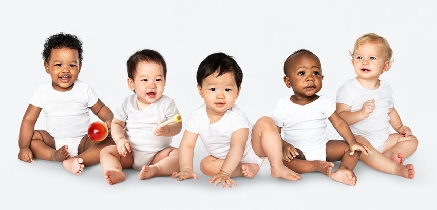 Five baby pose for a photo.